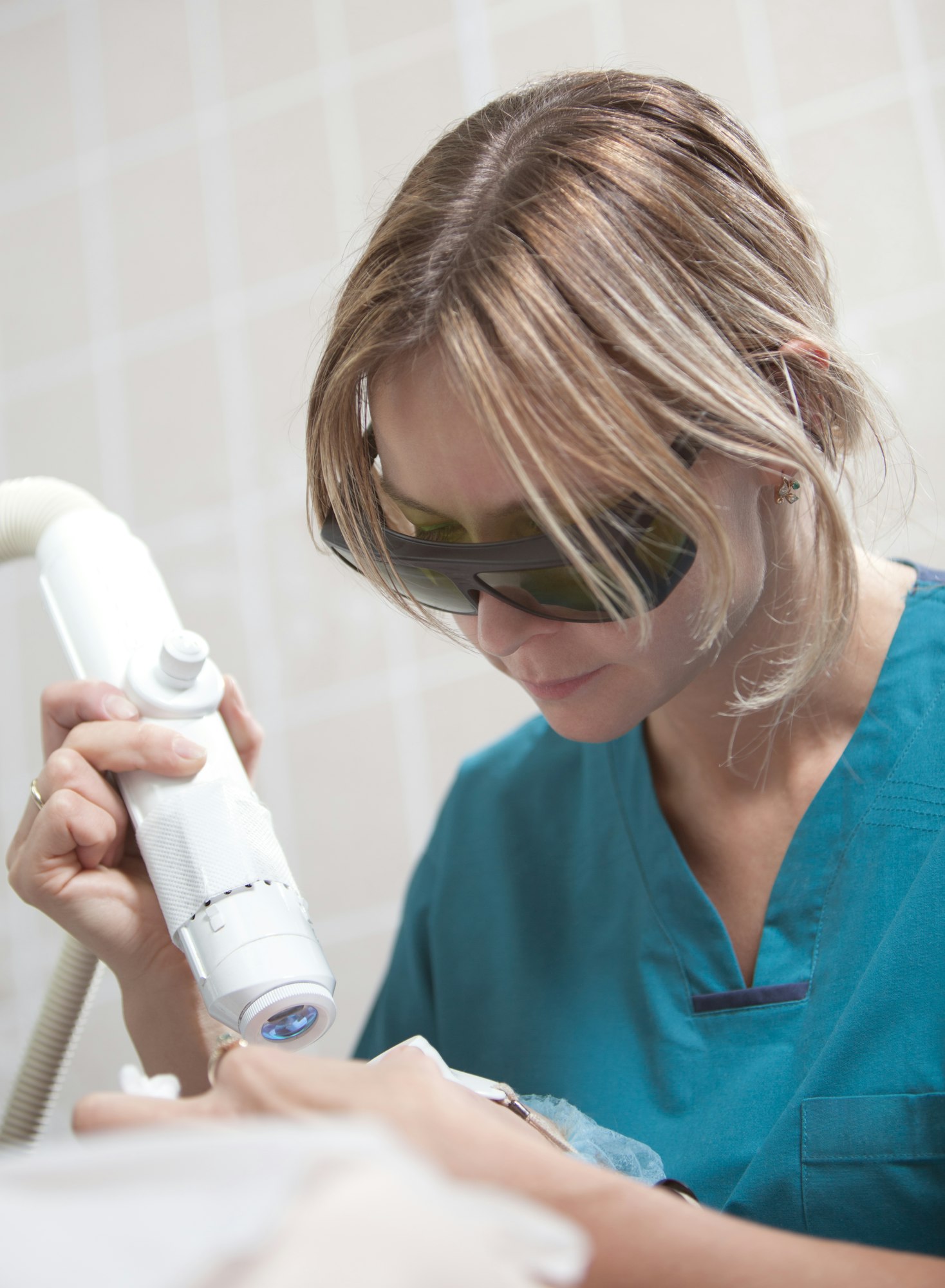 Facial treatment with laser in cosmetology clinic